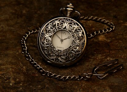 Pocket watch swinging used in hypnosis treatment photo