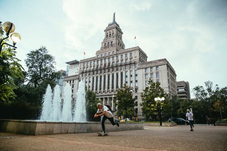 Skateboarding Past Fountain photo