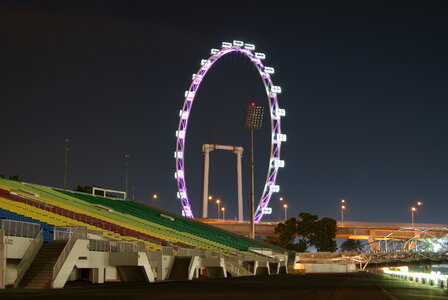 Singapore flyer and skyline at night photo