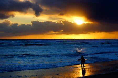 Fisherman At The Beach