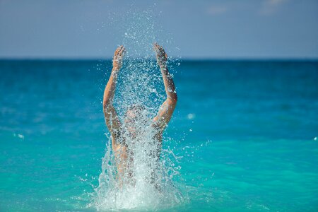 Boy playing splashing photo