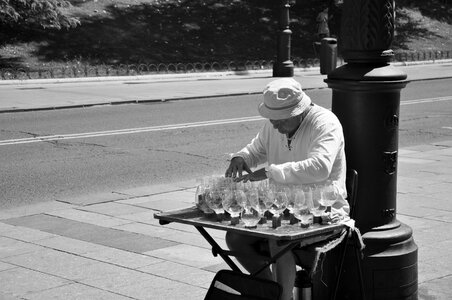 Man playing music on whineglasses photo