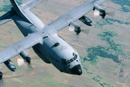 C-130 close up flying clear sky photo