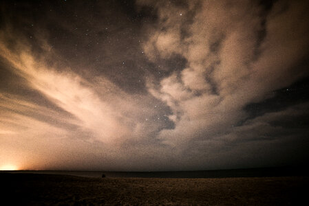 Starry Sky with Clouds on the Beach photo