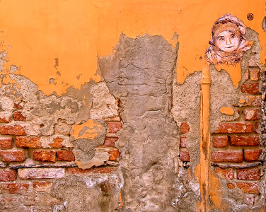 Cracked Concrete Brick Wall with Graffiti photo