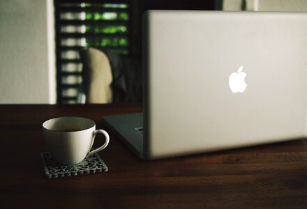 MacBook Laptop Wood Desk Coffee Cup photo