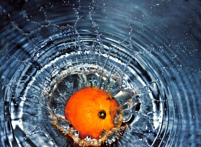 orange gets a splash of water photo