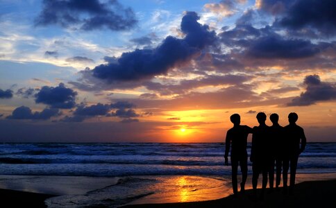 Friends Walking Together at Sunset photo