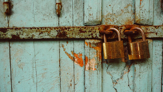 Aquamarine Grunge Door with Two Padlocks photo