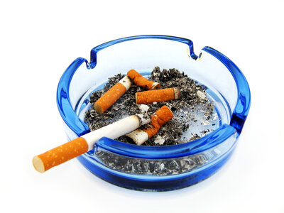 ashtray with cigarette photo