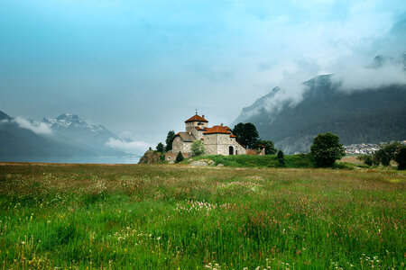 Castle on the end of a grassy field in Saint Moritz, Switzerland