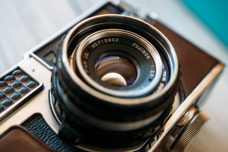 Detail of the lens of a very old camera