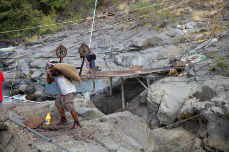 Yakama tribal members using a pulley system to transport salmon-1 photo