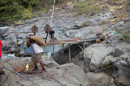 Yakama tribal members using a pulley system to transport salmon-1