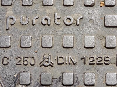Alphabet cast iron manhole cover photo