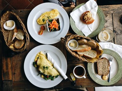 Omelette with freshly baked pastry in a café photo