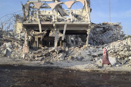 Woman people dilapidated house photo