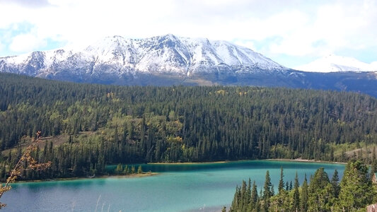 Majestic Landscape with lake, Mountains, and Forest in Yukon Territory, Canada photo