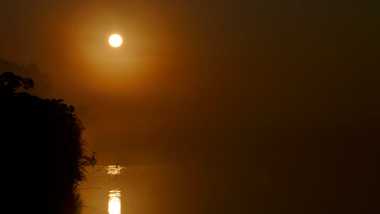 Early Morning Sun over the lake photo