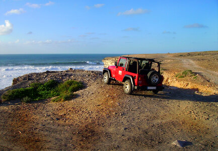 Jeep overlooking the ocean photo