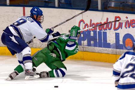 Sticks goal puck photo