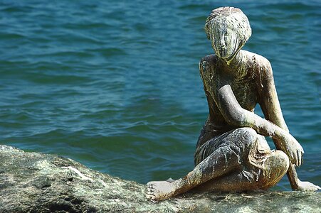 Woman sea rock