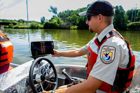 Fishery biologist checks sonar