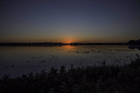 Sunset at dusk over Rice Lakes at George Meade Wildlife Refuge photo