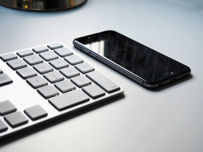 Keyboard and iPhone on Desk