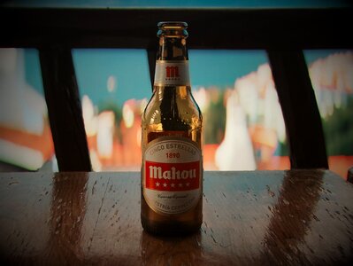 Beer Bottle on Wooden Table photo