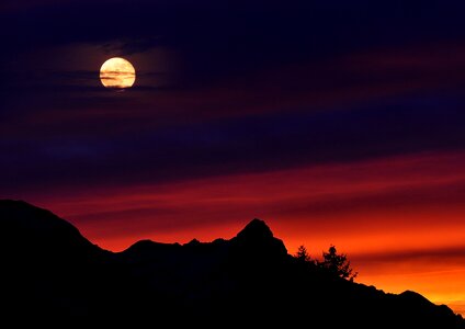 Sunrise moon lighting photo