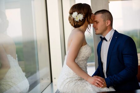 Bride kiss suit photo