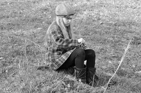 Girl sitting meadow photo