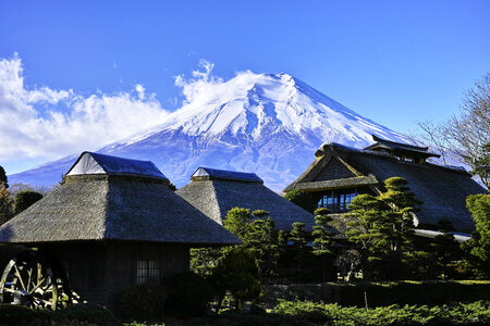 Mount Fuji rising above houses in Japan photo