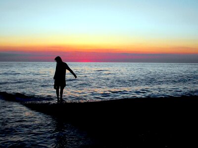 Happy Woman in Sea Sunset photo