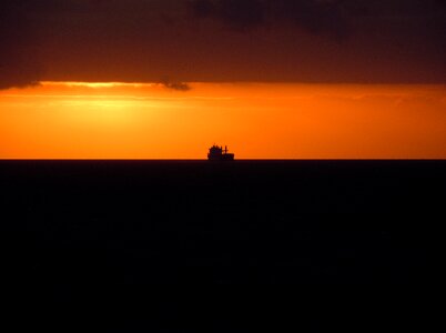 Sea ship evening sun photo
