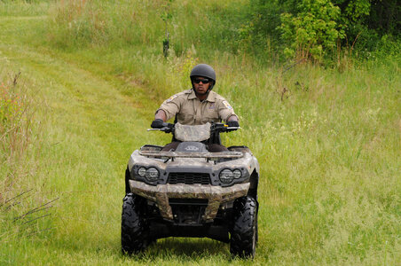 Refuge Law Enforcement Officer on ATV patrol-1