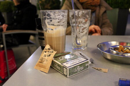 Latte macchiato, brown sugar and Pepe cigarettes photo