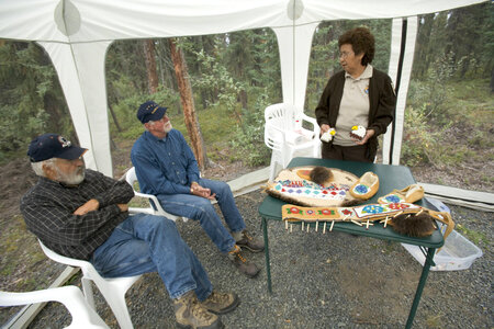 Service employee showing Native American crafts at Tetlin National Wildlife Refuge