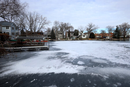 Sheet of ice and houses covering the harbor