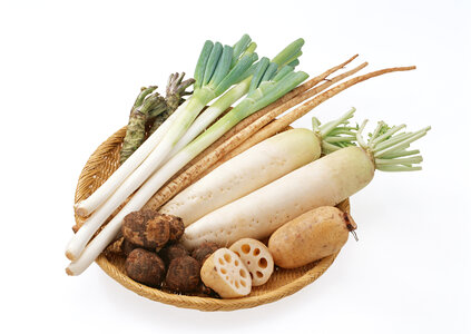 A variety of fresh vegetables laying on basket photo