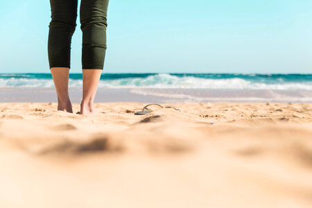 Girl standing in beach photo