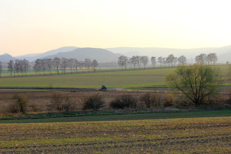View over fields onto the Harz mountains photo