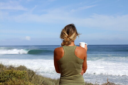 Blond Woman Looking at the Ocean Waves photo