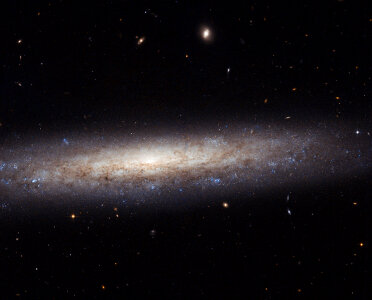Hubble Catches a Dusty Spiral in Virgo photo