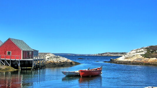 Boat and house landscape in Peggys Cove in Halifax, Canada photo