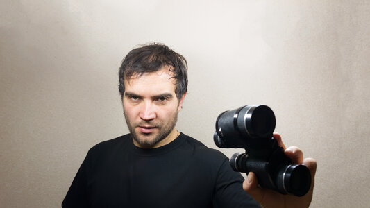 young man with binoculars photo