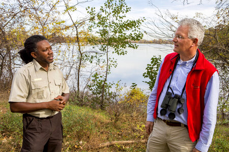 Employee communicates with a refuge visitor at John Heinz National Wildlife Refuge