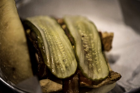 Burger with giant pickles on it
