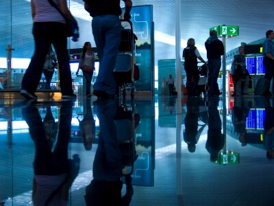 Passengers in an airport photo